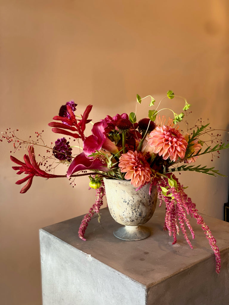 Eclectic composition in a low profile container