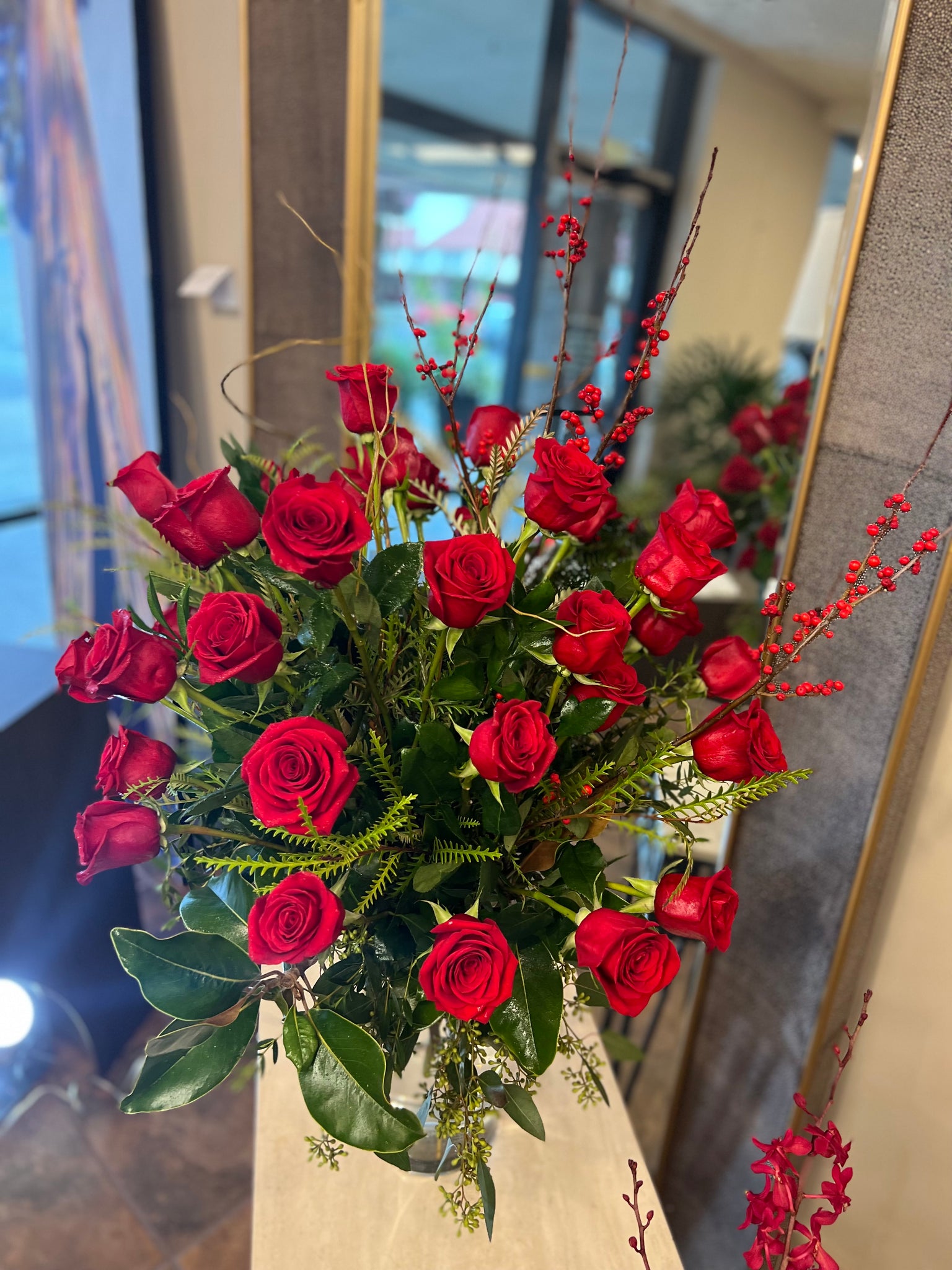 Three dozen roses classic design, curly willow branches & foliage, cylinder vase