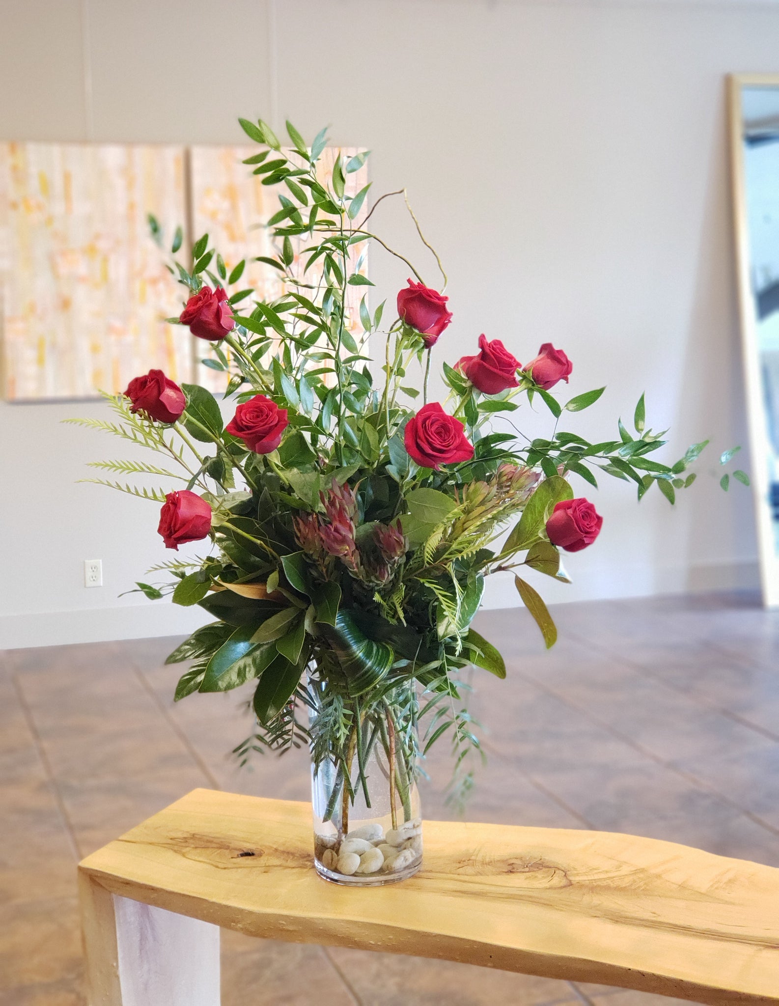 Classic dozen rose design, curly willow branches & foliage, cylinder vase