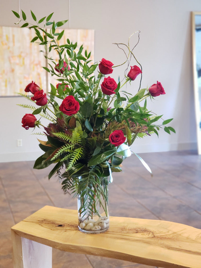 Classic dozen rose design, curly willow branches & foliage, cylinder vase