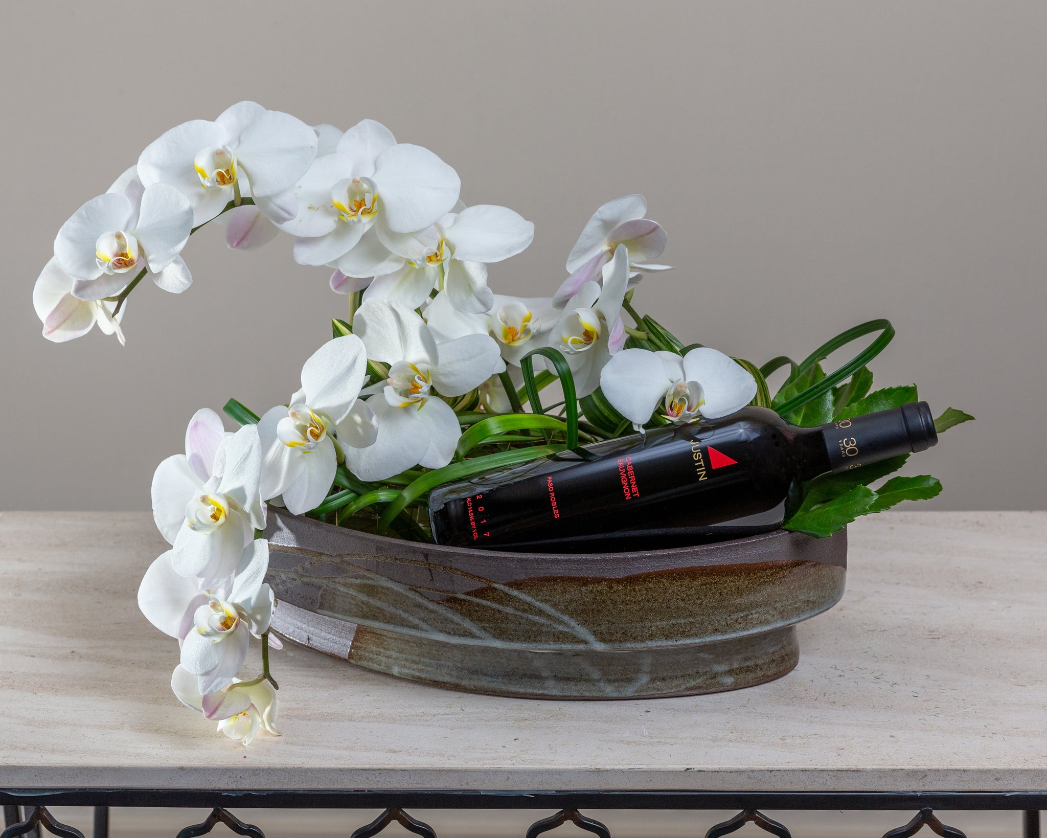 Orchids & foliage, Arakawa designer container, complimentary bottle of wine