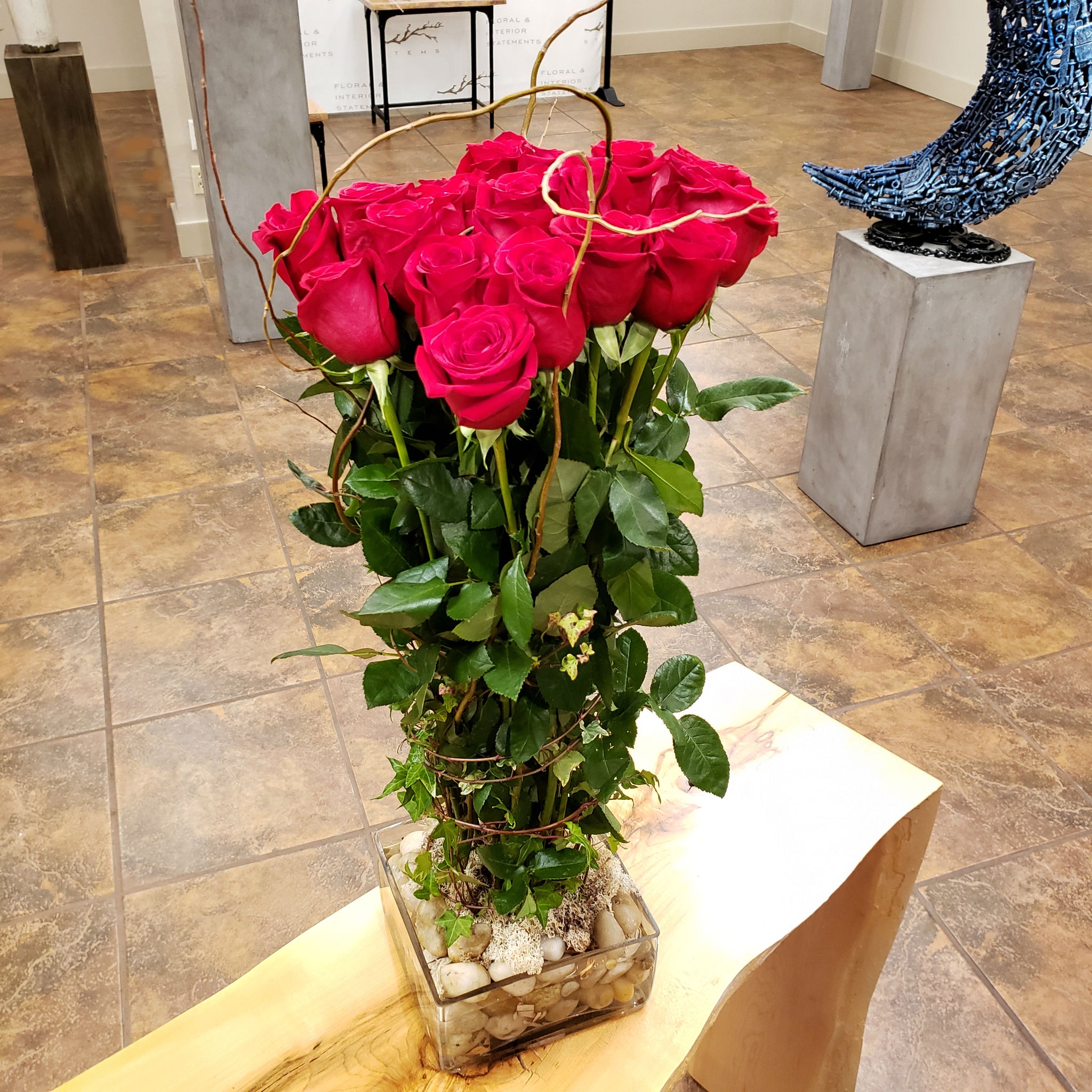 Bunched & semi-exposed roses (2 dozen), curly willow wrap, low profile vase