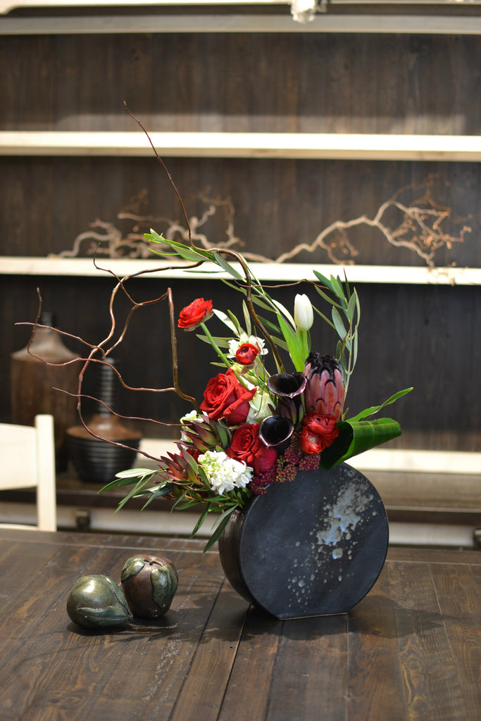 Handmade designer container, Reaching foliage & florals,