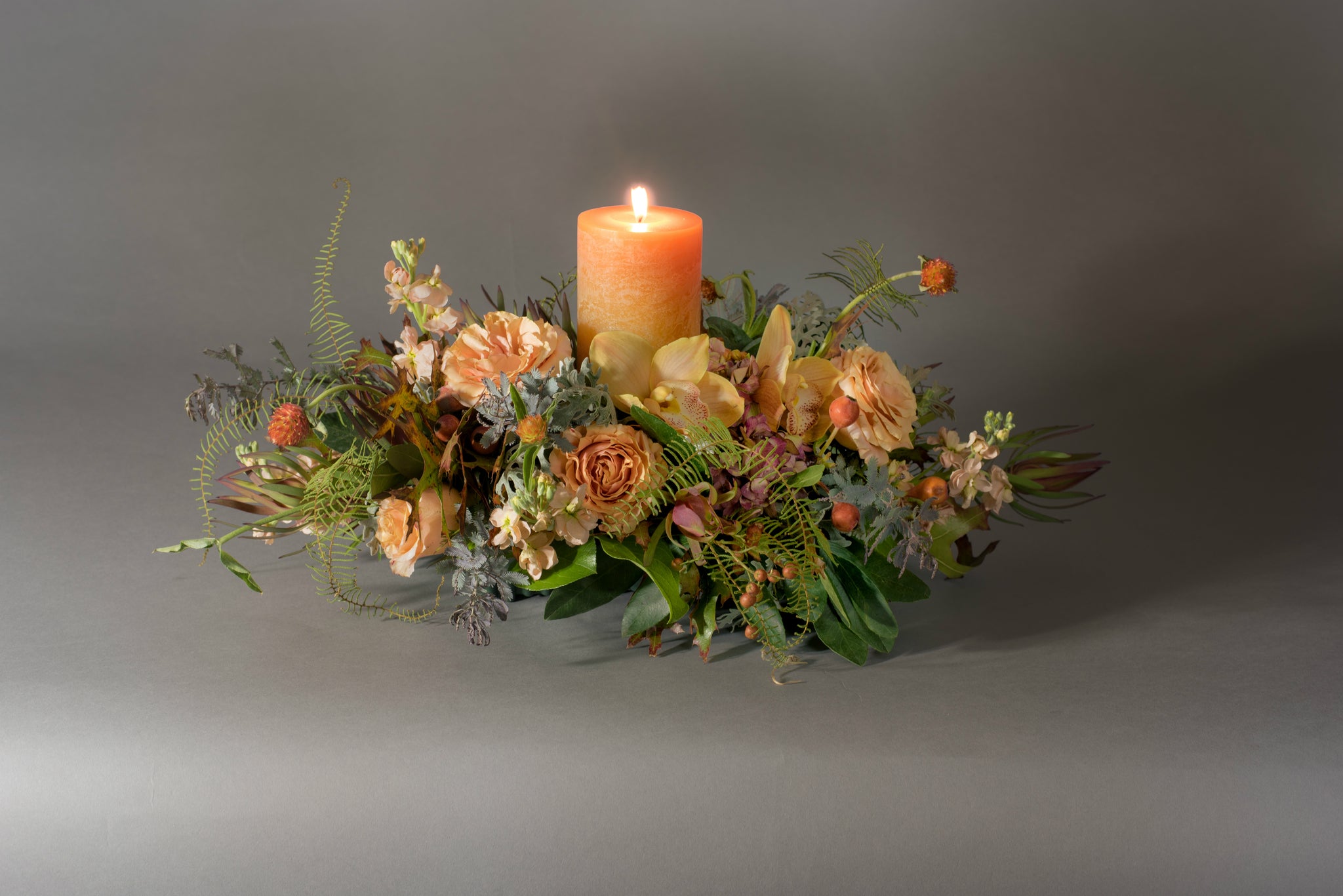Low & lush centerpiece with timber candle